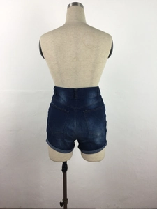 Detail view of the high waist denim shorts featuring back pockets and fixed cuffed hems