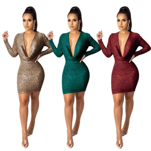Detail of sequin party dress showing deep V-neck and glitter fabric in multiple colors