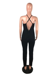 Detailed back view of a slim black backless jumpsuit with cross straps and embroidery