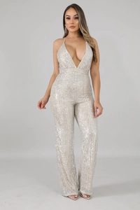 Detailed close-up of sparkling silver sequins on backless deep V-neck jumpsuit for women