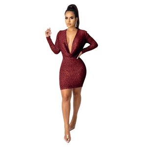Detail of deep red sequined fabric with deep V-neck and slim fit long sleeves for party wear