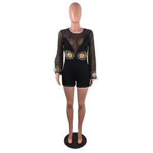 Detailed embroidery of colorful floral patterns on black lace long sleeve bodysuit