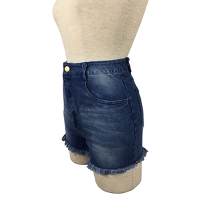 Detailed view of high-waist denim shorts featuring frayed hems and vintage washed finish