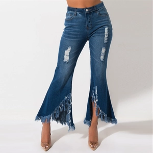 Asymmetric frayed fringe hem and ripped details on dark blue flared denim jeans