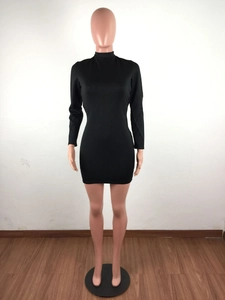 Detailed view of black backless long sleeve mini dress with a slim fit on a mannequin