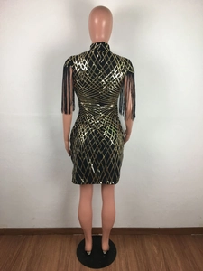 Detailed back view of a slim fit black dress with gold sequins and black shoulder tassels