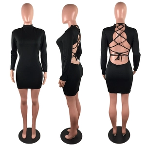 Three-way view of backless black mini dress showing cutout bandages and long sleeves
