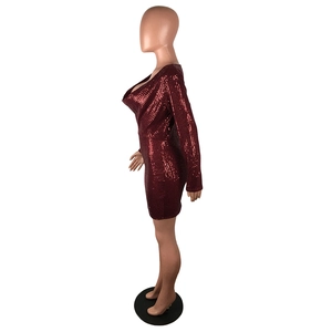 Detail view of burgundy sequin mini dress featuring a cowl neck and shimmering texture