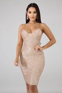 Detail of champagne gold sequined dress featuring thin straps and cup-shaped bodice structure