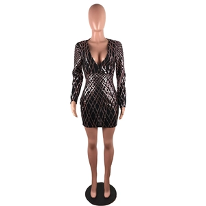 Close-up of rose gold geometric sequins on a black slim-fit V-neck party mini dress