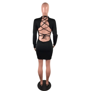 Detail of sexy backless black mini dress featuring crisscross bandage tie-up design