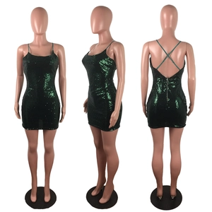 Three-way view of sequined emerald green bodycon dress with crisscross back and zipper detail