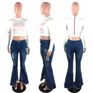 Detailed back view showing the unique red zipper closure on a white long sleeve crop top