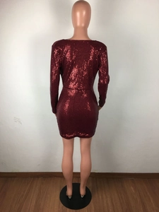 Detailed back view of the dark red sequin mini dress on a mannequin with long sleeves