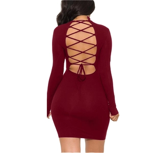 Macro detail of sexy backless lace-up design on burgundy bodycon long sleeve dress