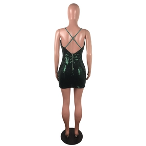 Detail of dark green sequin bodycon dress featuring crisscross back and long zipper closure