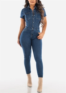 Detail of short sleeve denim jumpsuit featuring turn-down collar and buttoned chest pockets