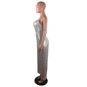 Detail view of silver sequin jumpsuit showing high-density shimmer fabric and side fit