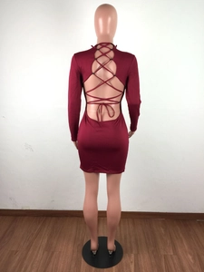 Close-up of wine red mini dress featuring multi-cross back bandage cut-out design