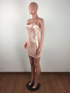 Close-up of rose gold sequin material on slim fit bodycon backless party dress
