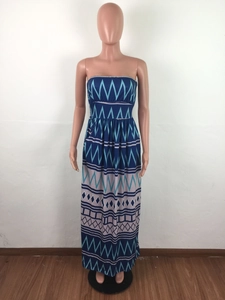 Detail of bohemian tube maxi dress with blue geometric patterns and floor-length hemline