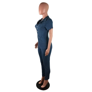 Detail view of dark blue short sleeve denim jumpsuit with silver buttons and waist loops