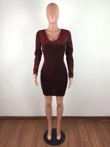 Close-up of deep red glitter fabric texture on a long sleeve V-neck bodycon mini dress