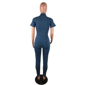 Detail view of the back of a slim-fit dark blue denim jumpsuit with short sleeves