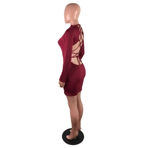 Detail view of burgundy long sleeve bodycon dress with sexy backless crisscross bandages