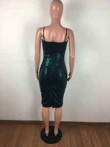 Detail view of the back of a dark green sequined bodycon dress with hidden zipper