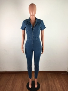 Detail showing high-waisted slim fit denim jumpsuit with metal buttons and chest pockets