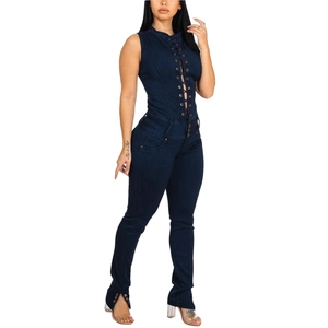 Slim fit dark blue denim jumpsuit featuring lace-up front and ankle side slits
