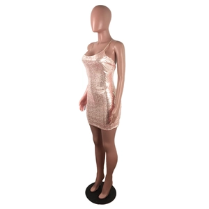 Detail of rose gold sequin bodycon dress showing shimmering texture and thin straps