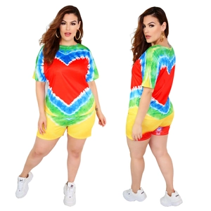 Women's plus size tie-dye set with round neck t-shirt and shorts featuring a heart pattern