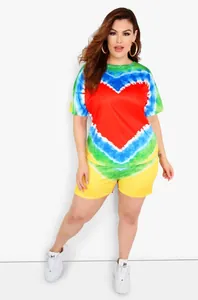 Detail of colorful tie-dye loungewear set featuring a heart print and elastic waistband