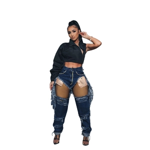 Fashion women's set with black one-shoulder top and distressed sequin fringe jeans