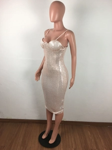 Detailed macro view of champagne sequin fabric on a slim fit bodycon party dress