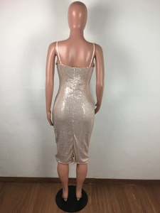 Detailed back view of champagne sequin dress with hidden zipper and hem slit design