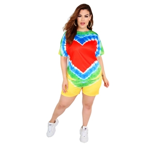 Close-up of vibrant tie-dye heart pattern on women's activewear t-shirt and shorts set