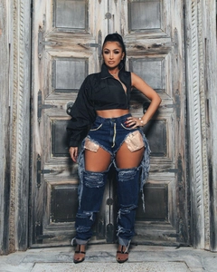 Fashion set with asymmetric black jacket and heavy distressed jeans with gold sequins