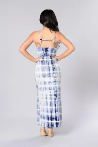 Detail of blue and white tie-dye maxi dress with open back and crisscross strap design