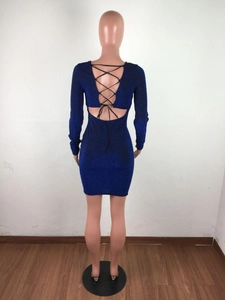 Detail of backless sequin mini dress featuring criss-cross bandage ties in royal blue