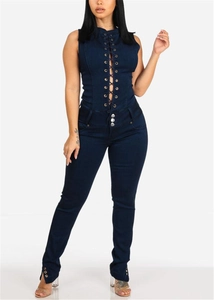 Detail of slim fit denim jumpsuit with lace-up front and metal button waist accents