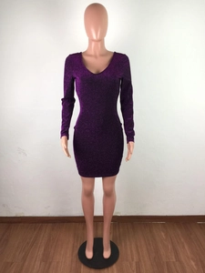 Detailed view of shimmering purple sequins on a sexy V-neck long sleeve mini dress