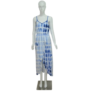 Detail of blue tie-dye maxi dress featuring wrap asymmetric hem and elastic waist