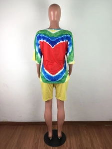 Tie-dye back view of a round neck t-shirt with red heart pattern and yellow shorts