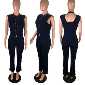 Detail view of navy denim slim fit jumpsuit featuring front lace-up and metal eyelets