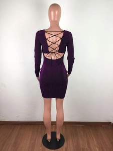 Detail view of purple sequin dress with cross-back bandages and open back design