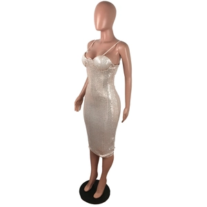 Close-up of champagne gold sequin bodycon midi dress with thin straps and heart neckline