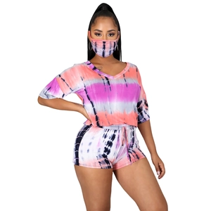 Three-piece women's tie-dye set with V-neck top, drawstring shorts, and matching face mask